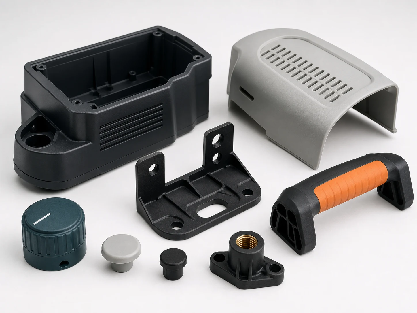 A range of custom molded plastic housings, brackets, knobs, and handles
